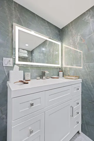 a bathroom with a sink and a mirror