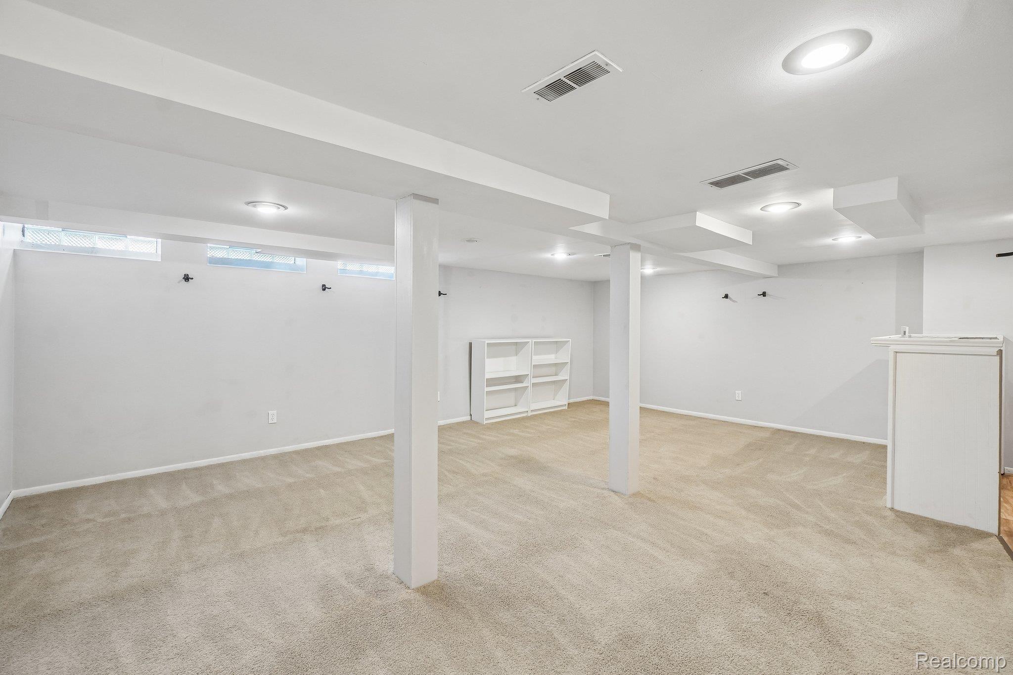 44 Stratford Lane Rochester, MI 48309 - Photo 26 of 37 Below grade area featuring light colored carpet