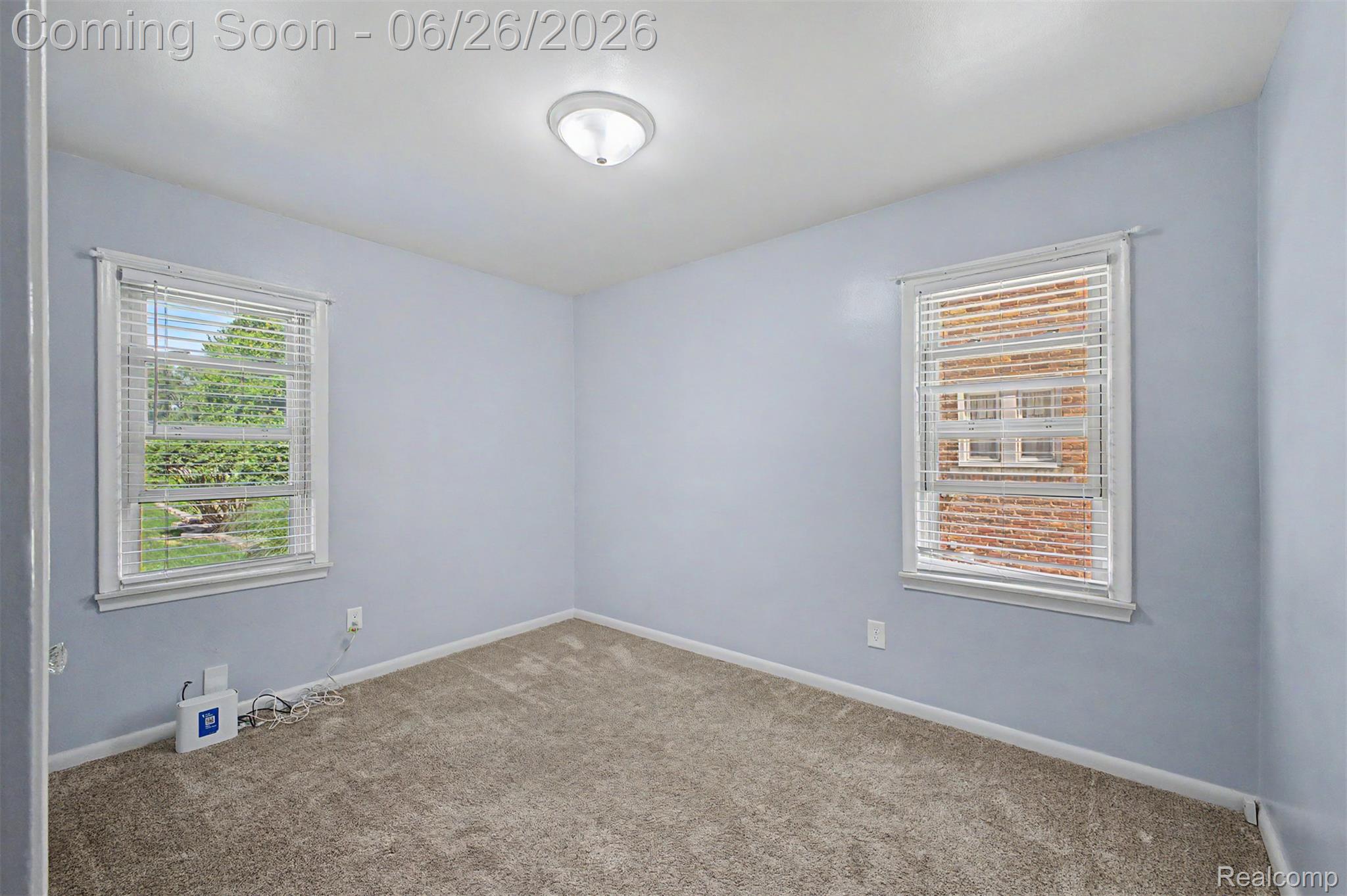 2216 Banner Street Dearborn, MI 48124 - Photo 10 of 34 Spacious room featuring light blue walls and neutral-toned carpeting