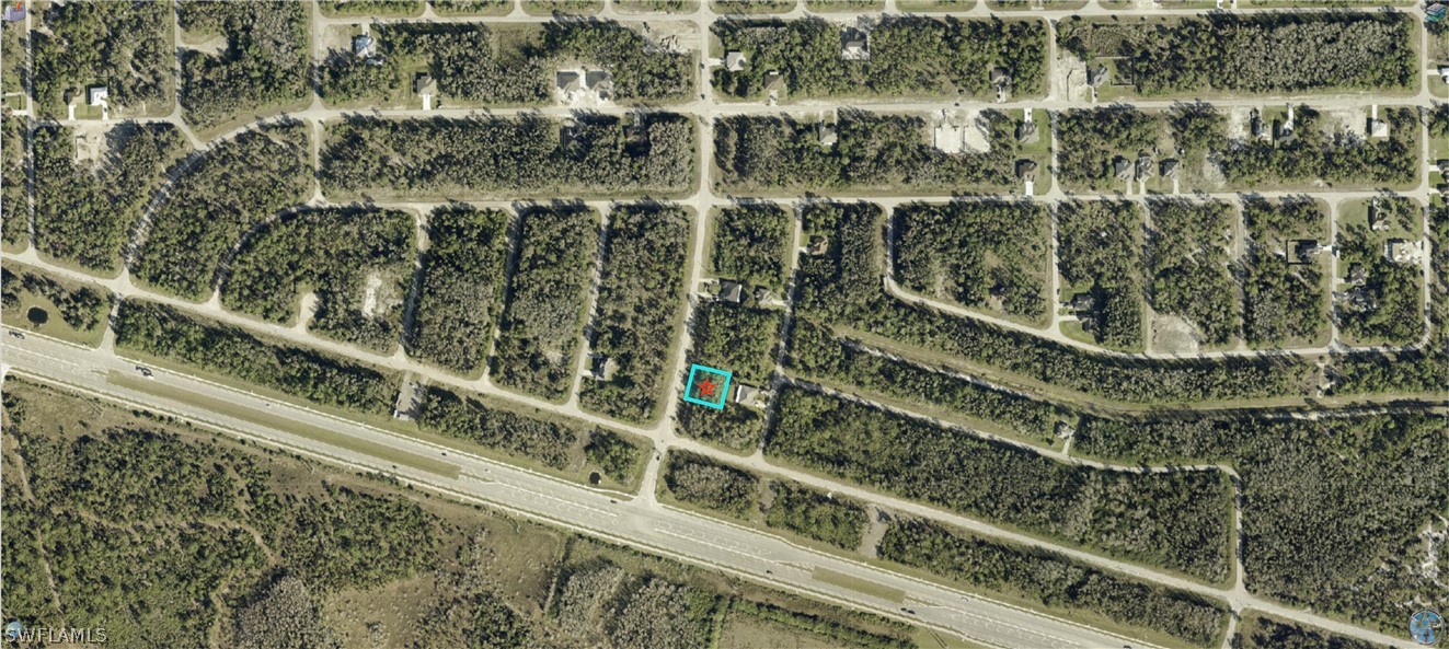 1041 Homestead Road South Lehigh Acres, FL 33974 - Photo 3 of 3 a view of a large building with a street