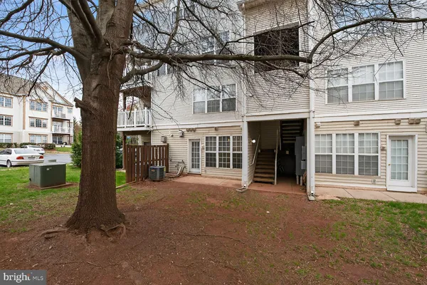 a front view of a building with a garden