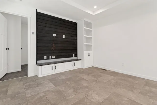 a view of an empty room with a fireplace