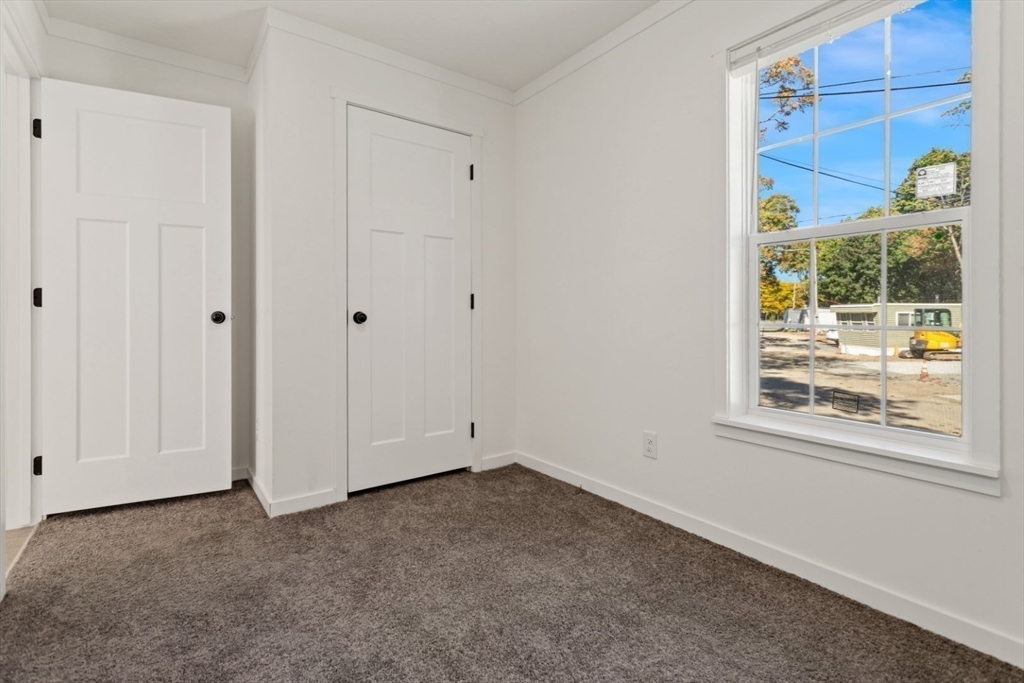 98 Newbury Street, Unit 4B Danvers, MA 01923 - Photo 15 of 32 a view of empty room with window