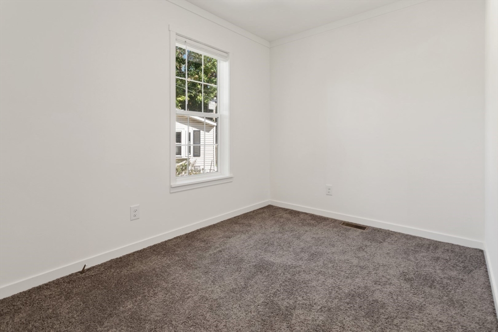 98 Newbury Street, Unit 4B Danvers, MA 01923 - Photo 17 of 32 an empty room with a window