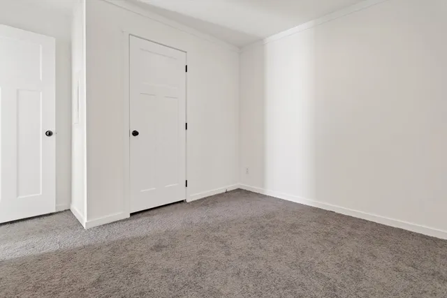 an empty room with closet area