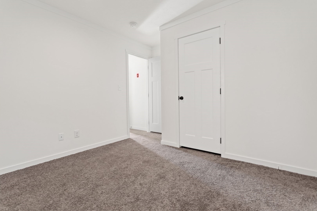 98 Newbury Street, Unit 4B Danvers, MA 01923 - Photo 22 of 32 an empty room with closet area