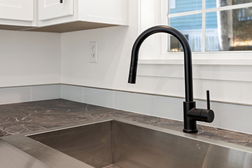 98 Newbury Street, Unit 4B Danvers, MA 01923 - Photo 9 of 32 a view of a garage