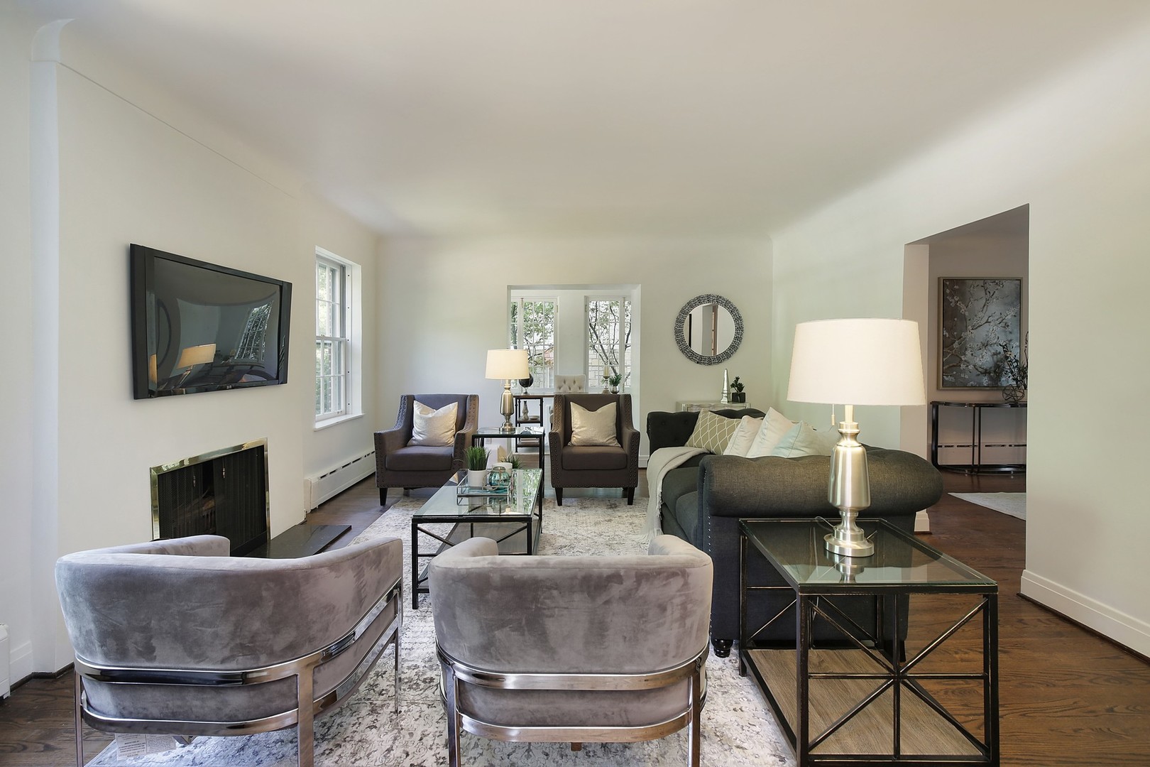 206 Sheridan Road Winnetka, IL 60093 - Photo 2 of 20 a living room with furniture a fireplace and a flat screen tv