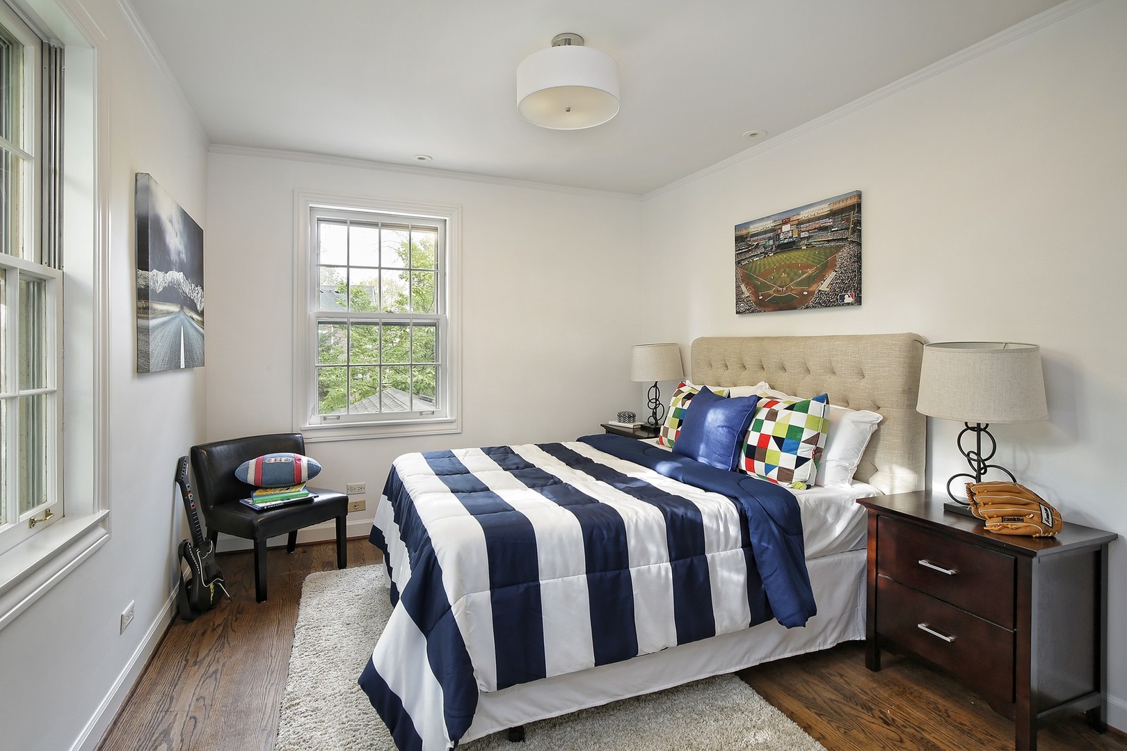 206 Sheridan Road Winnetka, IL 60093 - Photo 12 of 20 a bedroom with a bed and wooden floor