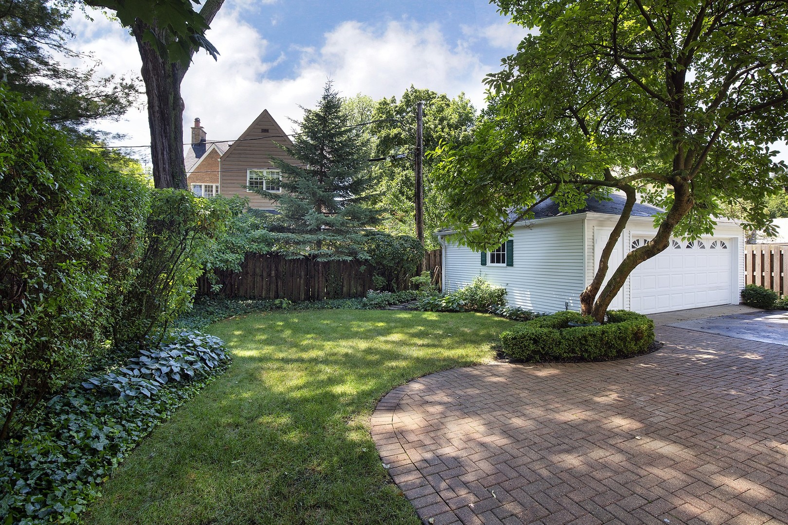206 Sheridan Road Winnetka, IL 60093 - Photo 15 of 20 a front view of a house with garden
