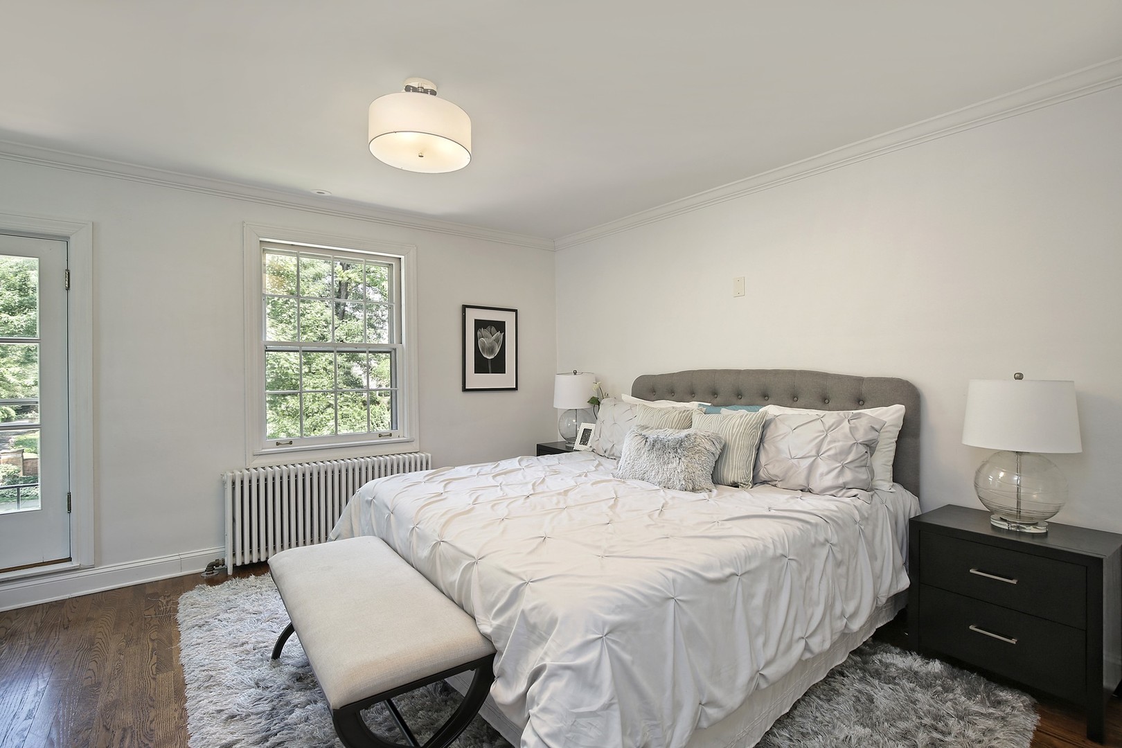 206 Sheridan Road Winnetka, IL 60093 - Photo 10 of 20 a bedroom with a bed and wooden floor