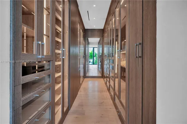 a bedroom with a bed and glass wall
