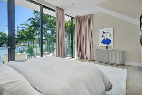a bedroom with a bed and a chair