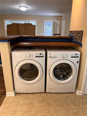 a utility room with dryer and washer