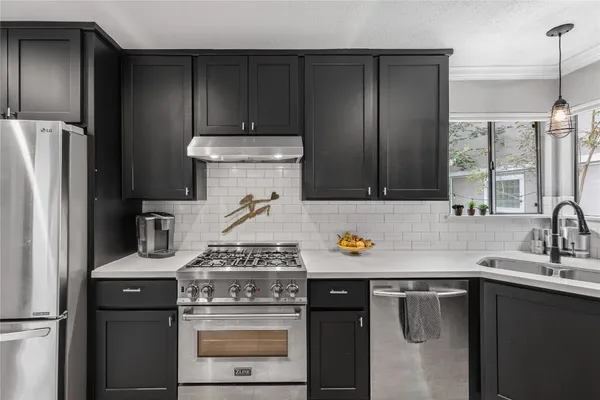 a white toilet sitting next to a bathroom sink