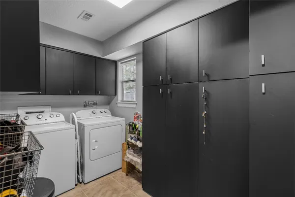 a living room with furniture and a piano