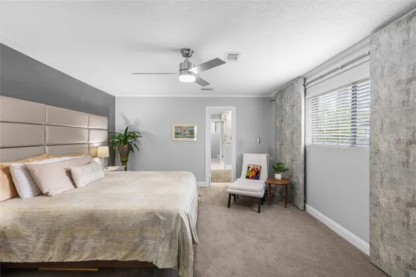 a view of house with backyard and sitting area