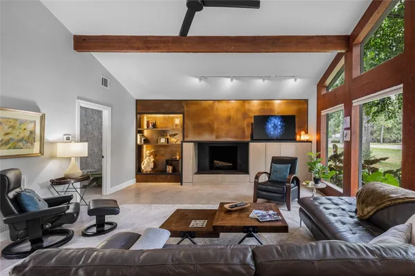 a view of a dining room with furniture and a large window