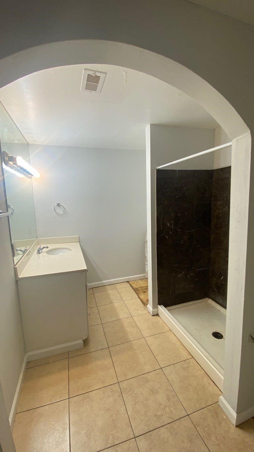 1918 Oleander La Marque, TX 77568 - Photo 15 of 20 a bathroom with a sink and mirror