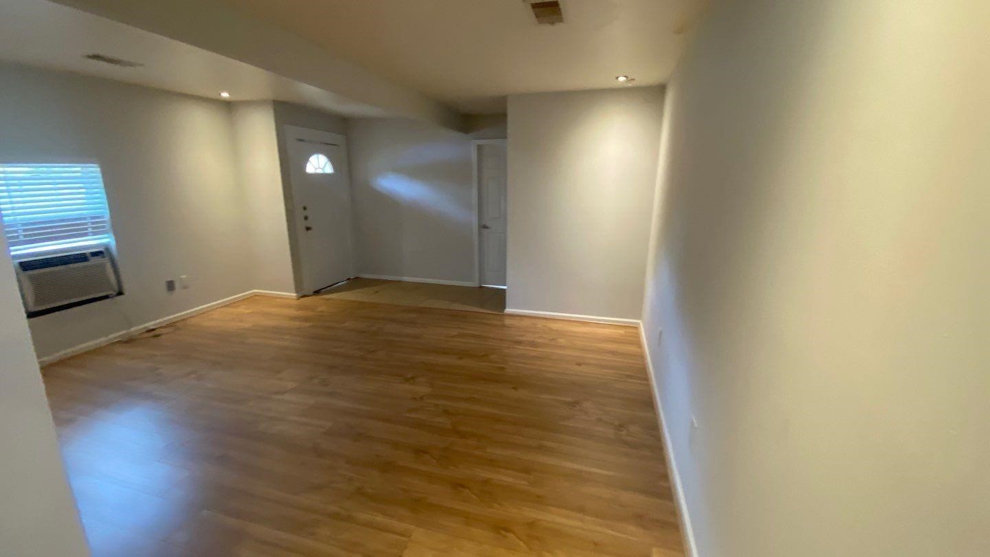 1918 Oleander La Marque, TX 77568 - Photo 2 of 20 a view of empty room with wooden floor