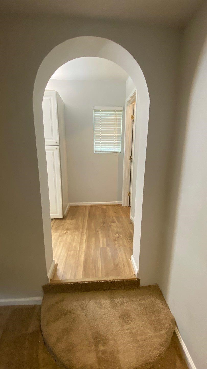 1918 Oleander La Marque, TX 77568 - Photo 8 of 20 an empty room with wooden floor and a window
