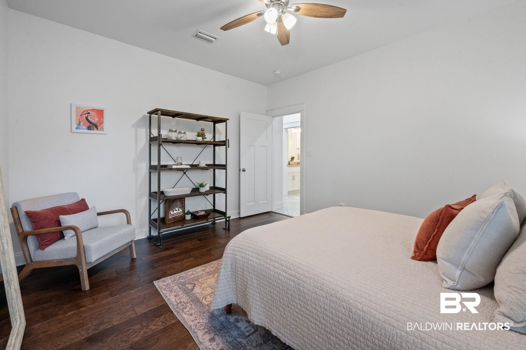 418 Fortune Drive Fairhope, AL 36532 - Photo 34 of 63 Bedroom with ensuite bath, ceiling fan, and dark hardwood / wood-style flooring