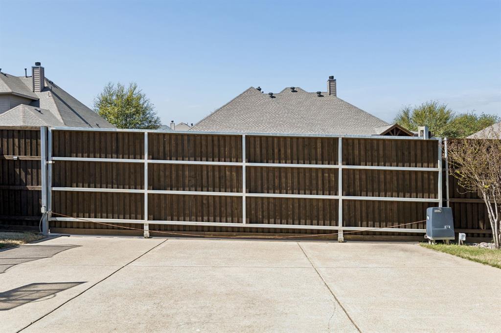 3917 Gatewick Drive Rockwall, TX 75087 - Photo 30 of 34 a view of a house with a wooden door