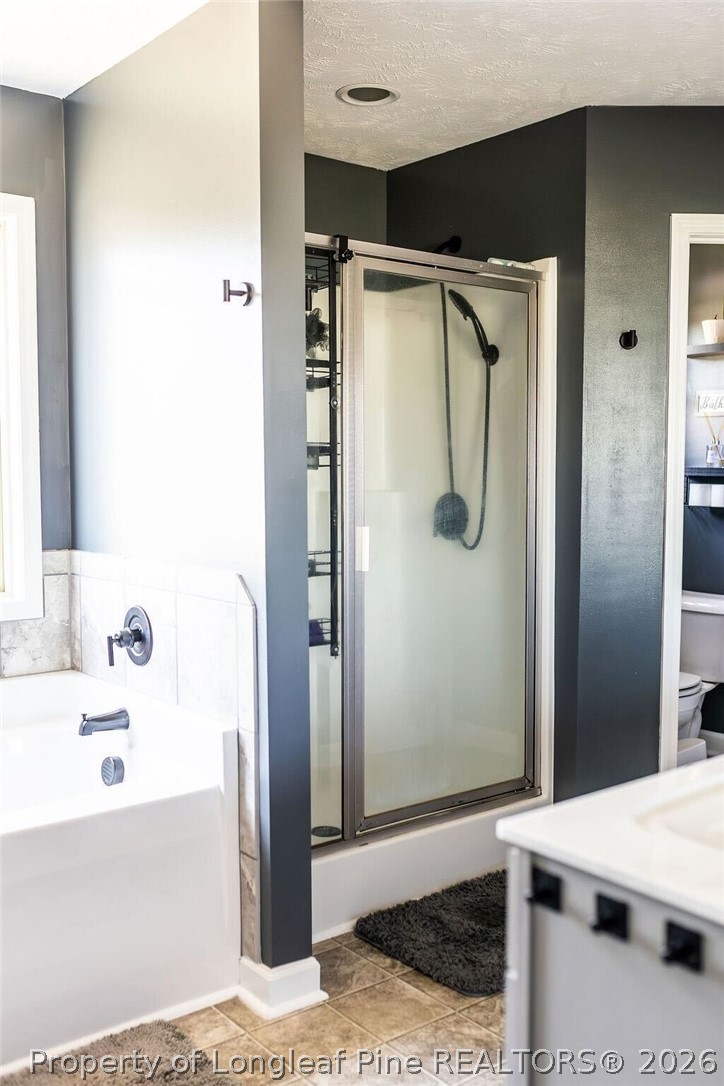 210 McGougan Road Lumber Bridge, NC 28357 - Photo 27 of 47 a bathroom with a shower and a tub