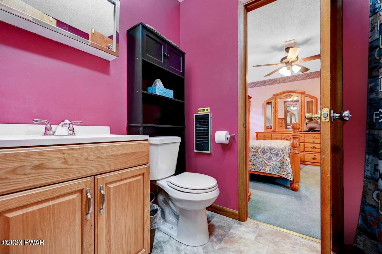 413 Northgate Road Lake Ariel, PA 18436 - Photo 37 of 59 a bathroom with a sink a toilet and a shower