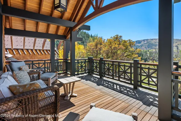 a view of a balcony with chairs
