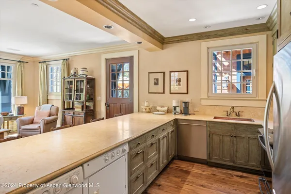 a kitchen with a sink and cabinets