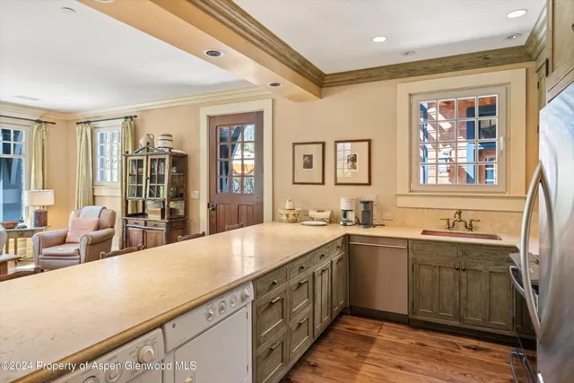 a kitchen with a sink and cabinets