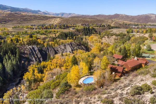 a view of a city with mountains in the background
