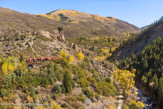a view of a mountain range in a cloudy sky