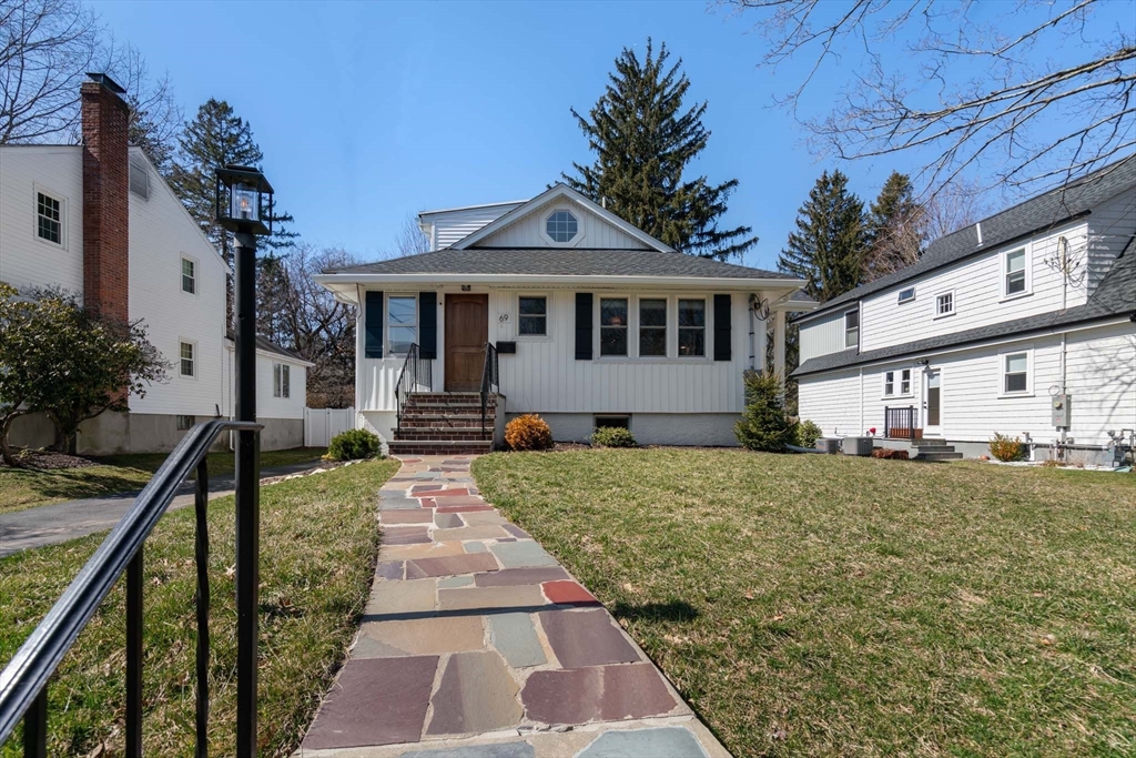 69 Henderson Street Needham, MA 02492 - Photo 1 of 26 a front view of a house with a yard