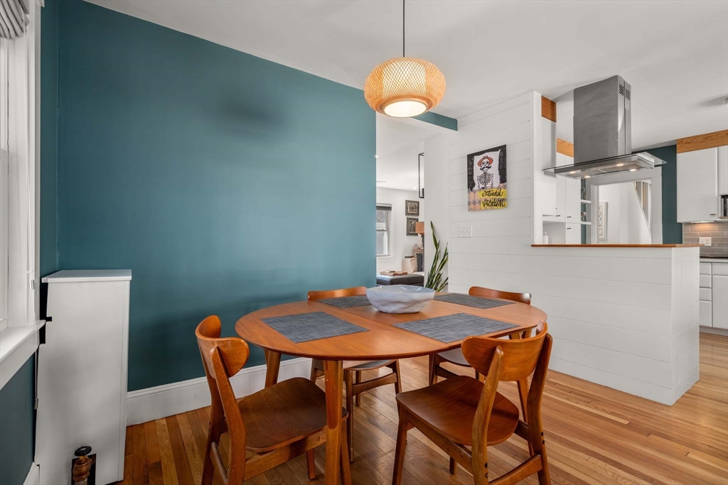 69 Henderson Street Needham, MA 02492 - Photo 11 of 26 a view of a dining room with furniture and wooden floor