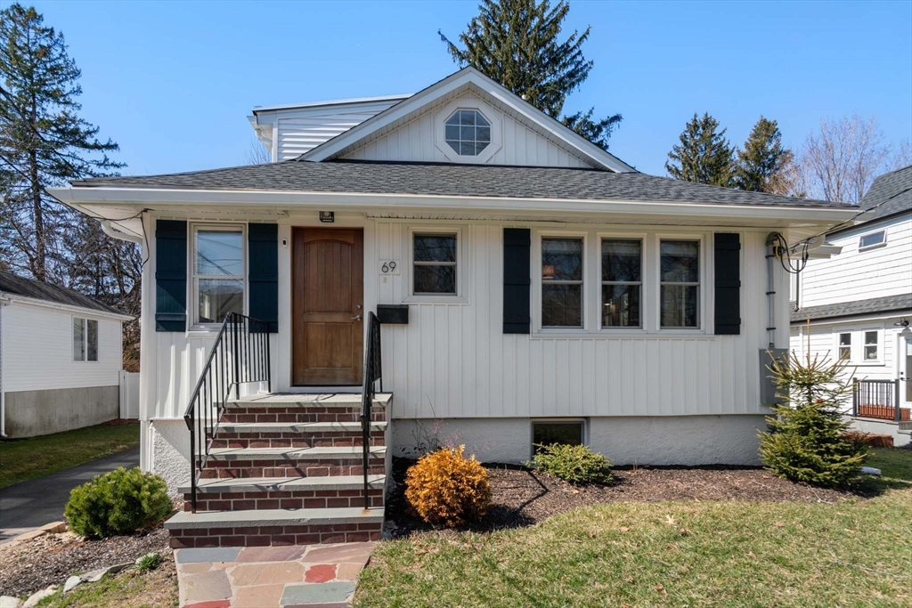 69 Henderson Street Needham, MA 02492 - Photo 2 of 26 a front view of a house with plants