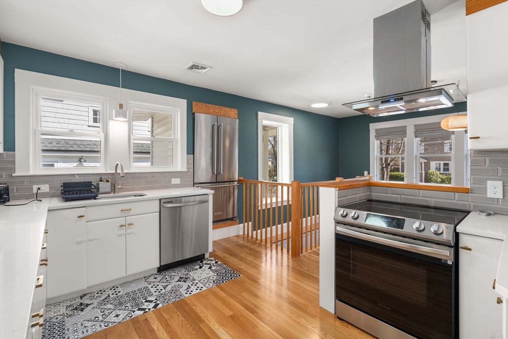 69 Henderson Street Needham, MA 02492 - Photo 7 of 26 a kitchen with a stove oven and sink