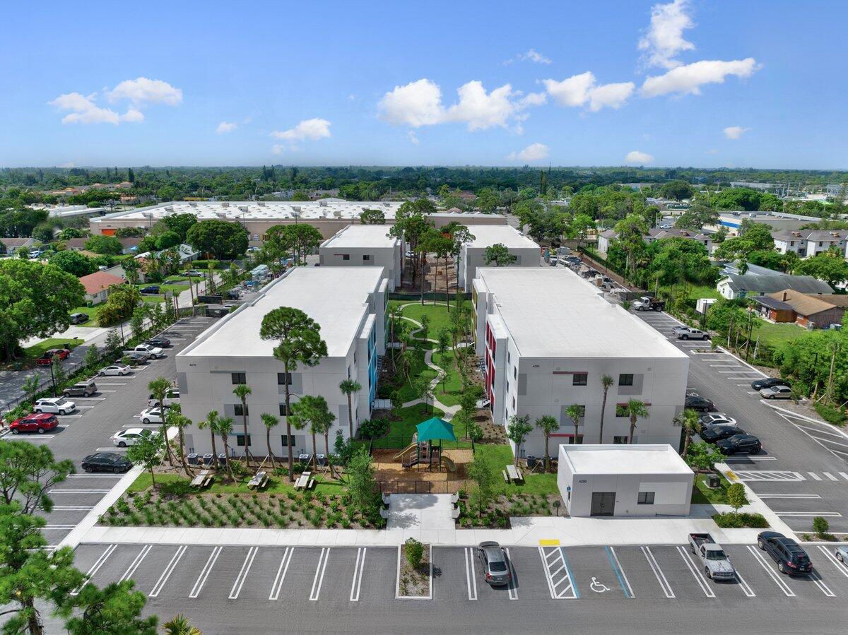 4250 Lakewood Road, Unit 101 Palm Springs, FL 33461 - Photo 20 of 20 an aerial view of multiple houses