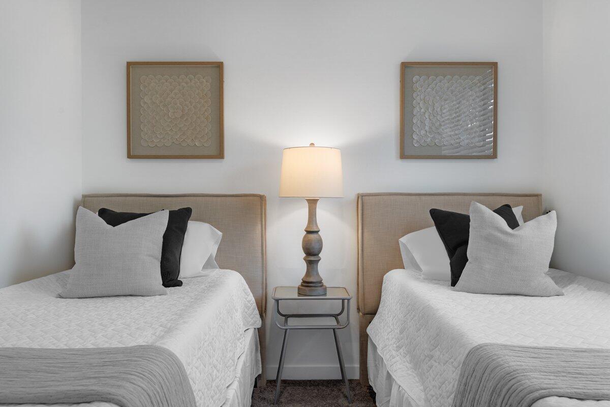 4250 Lakewood Road, Unit 101 Palm Springs, FL 33461 - Photo 6 of 20 a bedroom with two beds and white walls