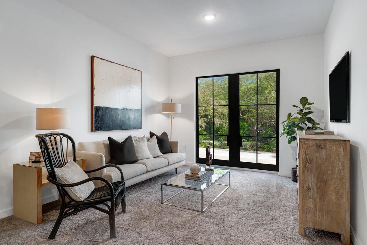 4250 Lakewood Road, Unit 101 Palm Springs, FL 33461 - Photo 8 of 20 a living room with furniture and a flat screen tv