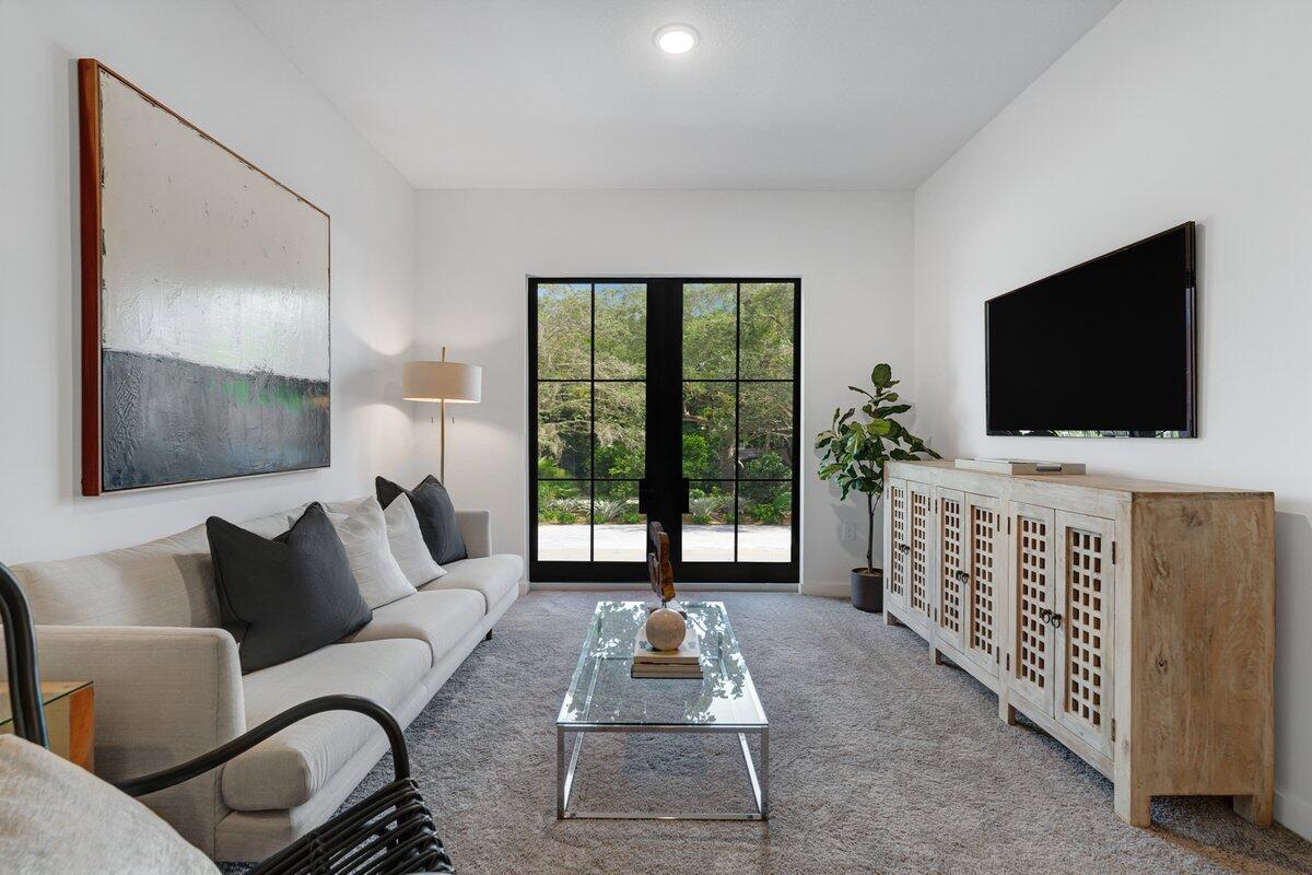 4250 Lakewood Road, Unit 101 Palm Springs, FL 33461 - Photo 9 of 20 a living room with furniture and a flat screen tv