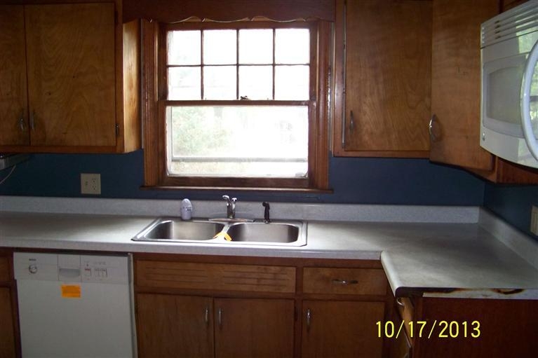 4096 Ross Road Gary, IN 46408 - Photo 4 of 9 a kitchen with a sink and a window