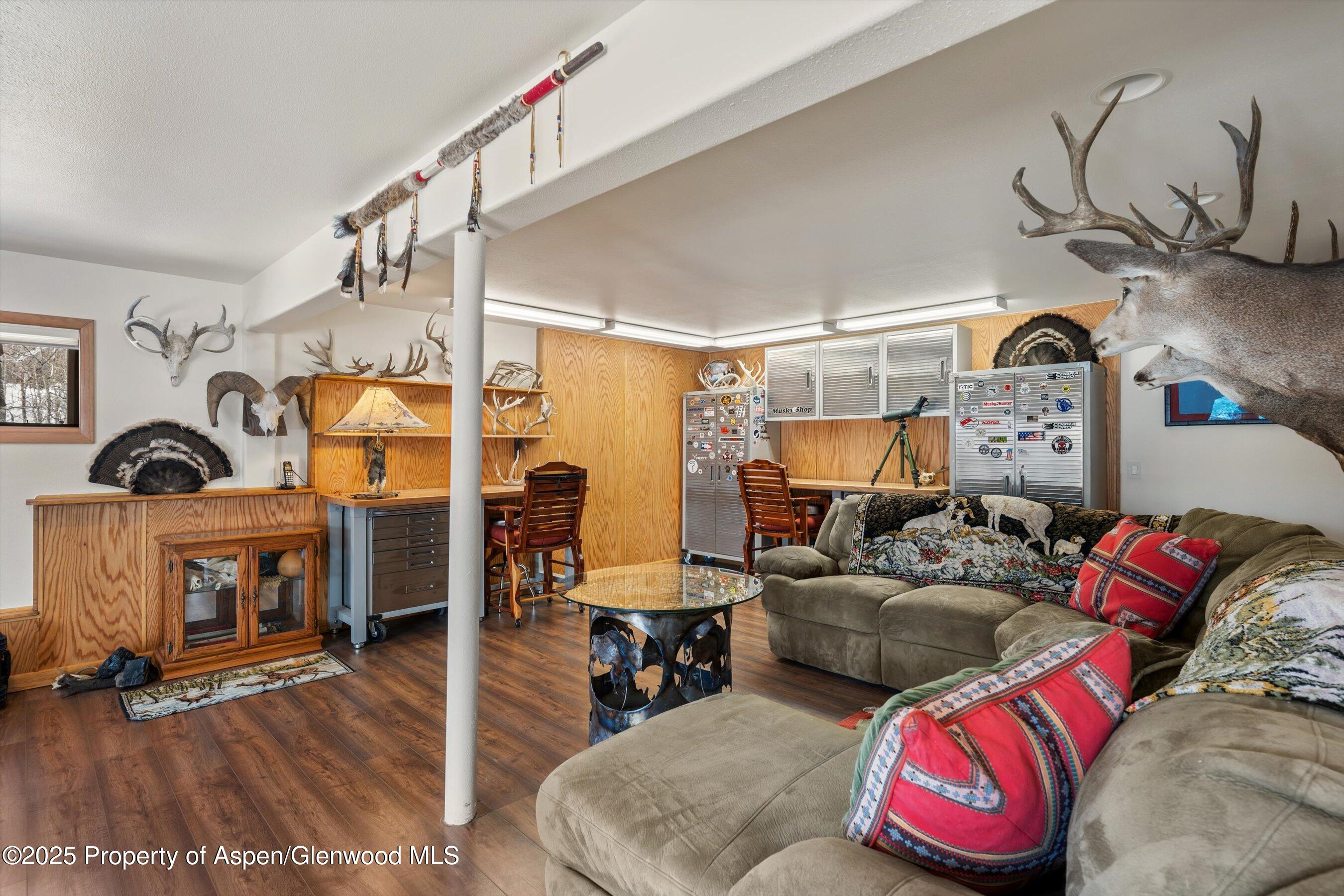 238 Hawk Lane Basalt, CO 81621 - Photo 35 of 46 a living room with furniture and a floor to ceiling window