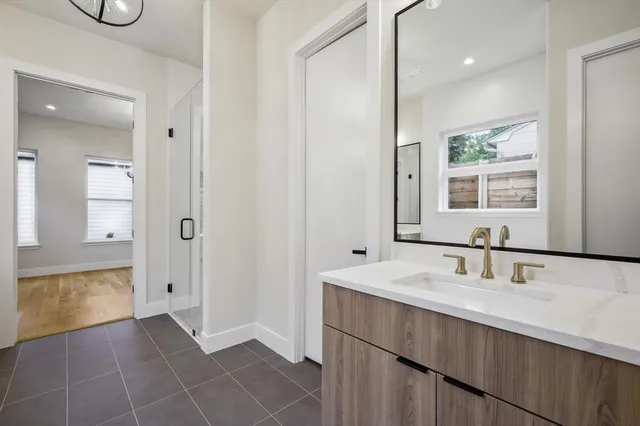 a bathroom with a sink a mirror and a bathtub