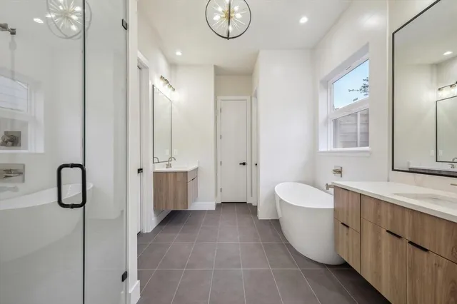 a bathroom with a sink a mirror and a bathtub