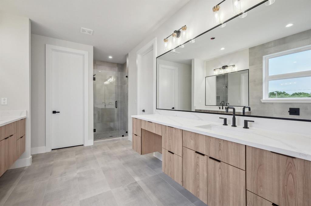 3902 Park Lane Dallas, TX 75220 - Photo 20 of 36 a bathroom with a double vanity sink mirror and double