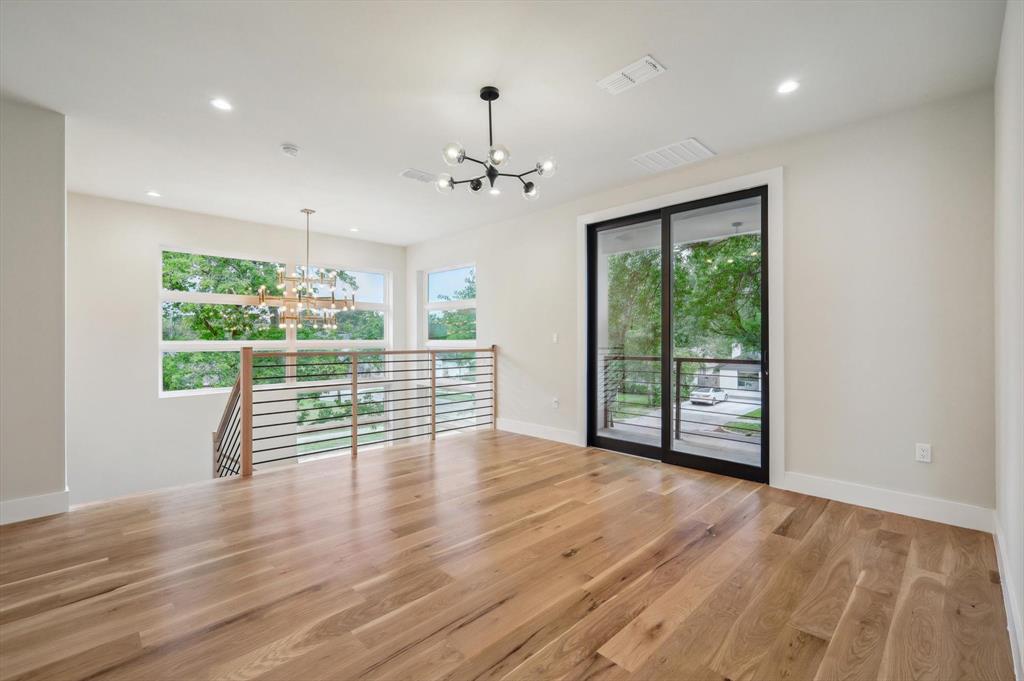 3902 Park Lane Dallas, TX 75220 - Photo 24 of 36 a view of an empty room with wooden floor and a window