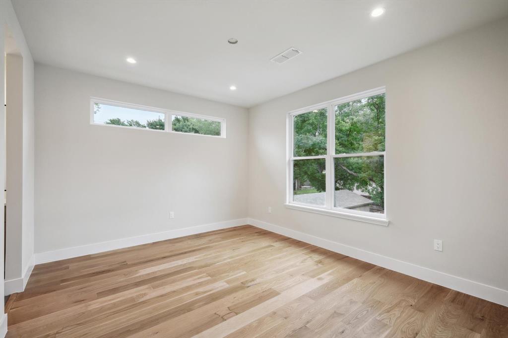 3902 Park Lane Dallas, TX 75220 - Photo 29 of 36 an empty room with wooden floor and windows