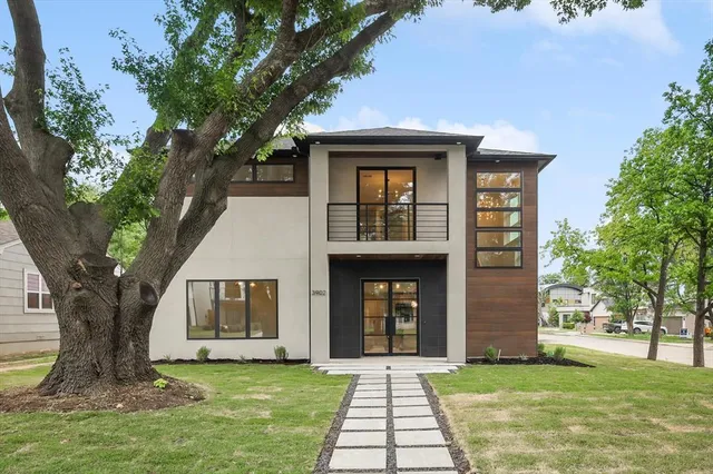 an aerial view of a house with a yard basket ball court and outdoor seating